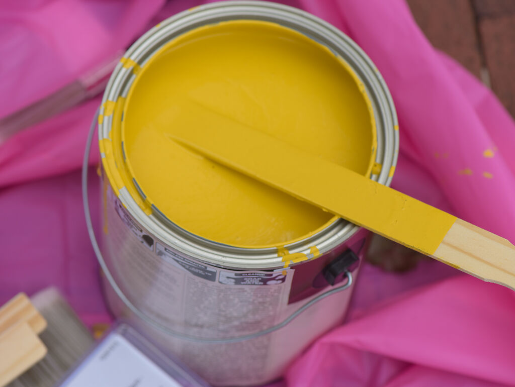 A bucket of yellow paint